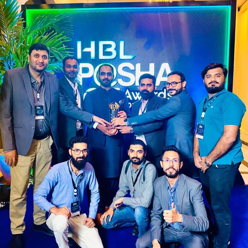 The team celebrating together with a P@SHA award